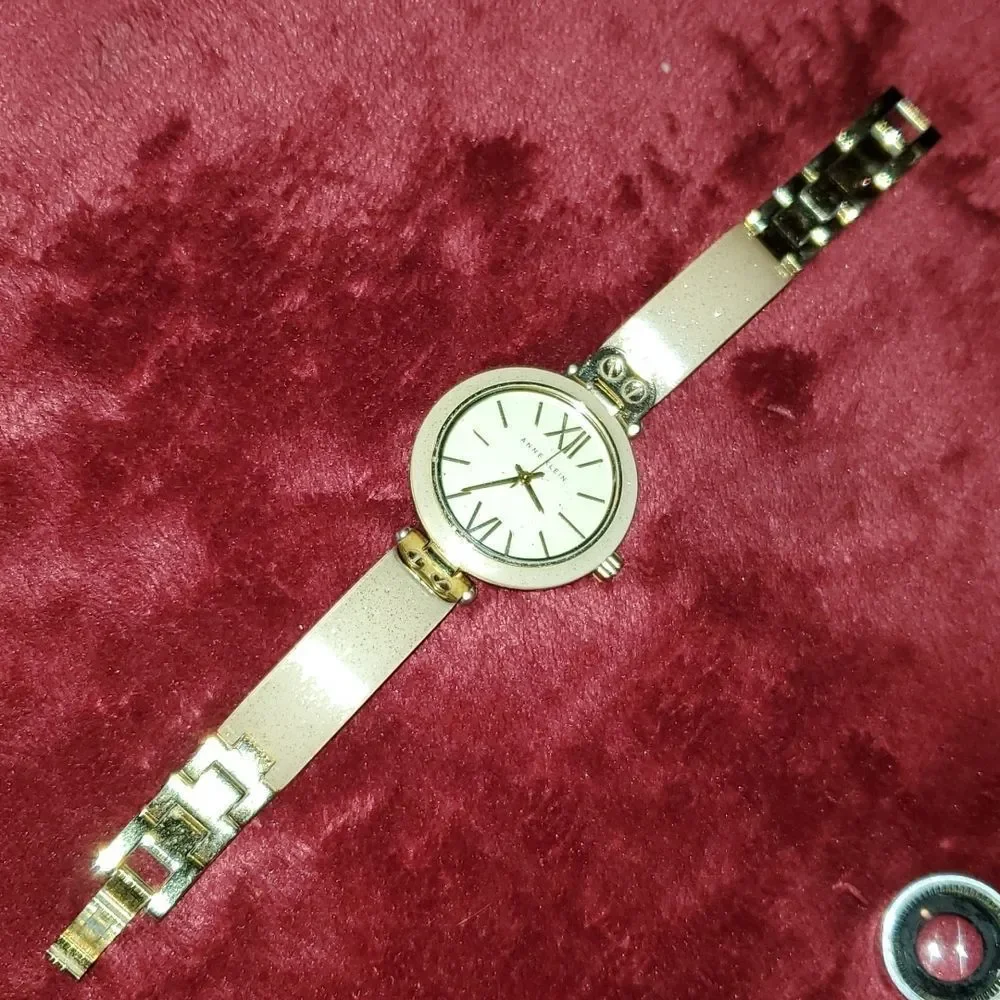 Anne Klein Women's AK-1408CRCR‎ Gold Plastic Analog Quartz Bangle Style Watch